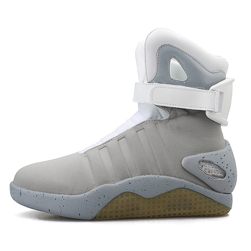 Gray high-top sneaker with white strap on a white background