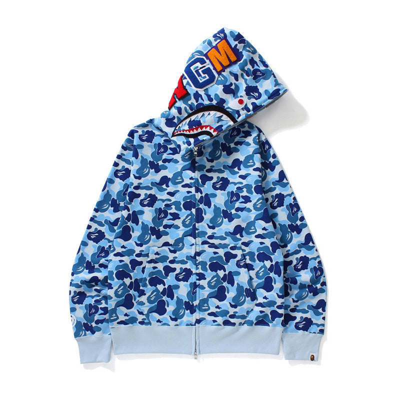 Blue camouflage hoodie with shark mouth design and brand logo on a white background