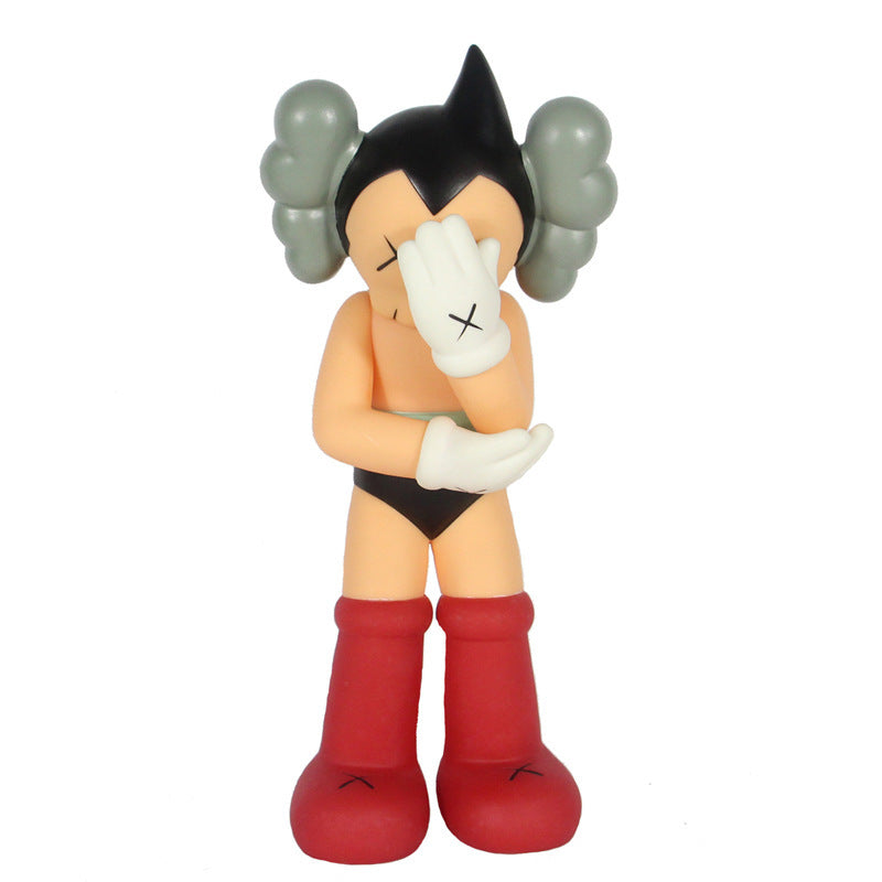 A stylized collectible figure of a character with black hair in twin buns, a white glove covering one eye, a black brief, and red boots, photographed against a plain white background.