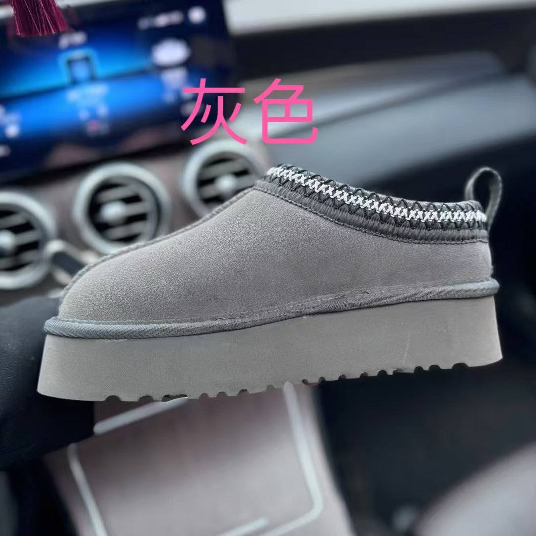 Gray shoe with white sole on a car dashboard