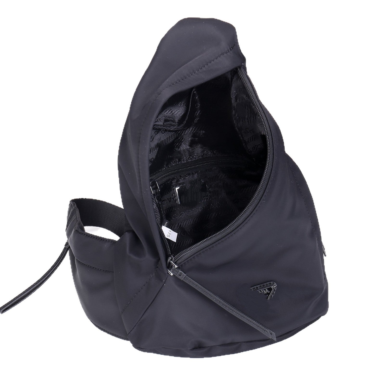 A black sling backpack shown open to display its interior storage compartments and zipper details, set against a plain white background.