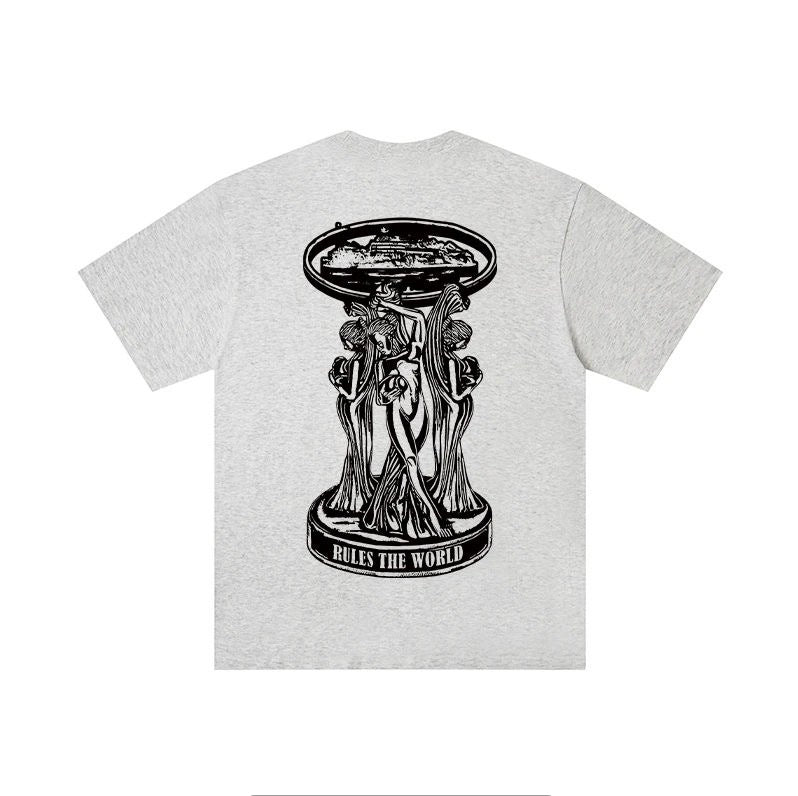 A light heather gray short-sleeve t-shirt shown from the back, featuring a large black graphic print of a classical sculpture with a ship on its head and the text 'RULES THE WORLD' at the base.