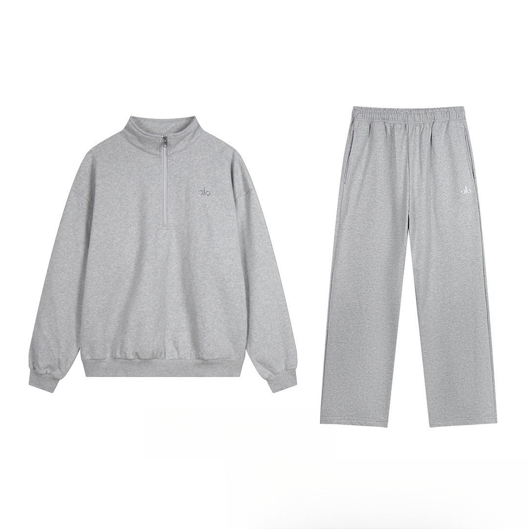 Gray tracksuit with a small logo on a white background
