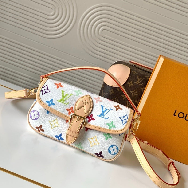 A Louis Vuitton shoulder bag in white monogram canvas with multicolor floral motifs and tan leather trim, shown with a matching box on a light surface.