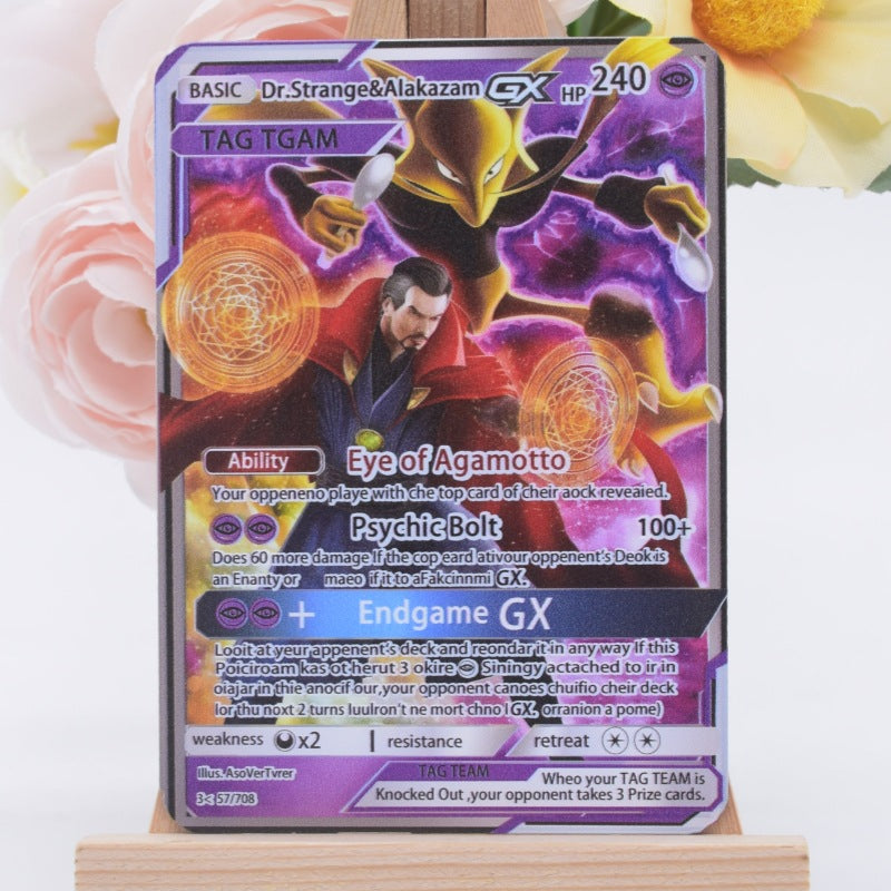 A Pokémon trading card featuring Dr. Strange and Alakazam, displayed upright on a small wooden stand with soft pink and yellow flowers blurred in the background.