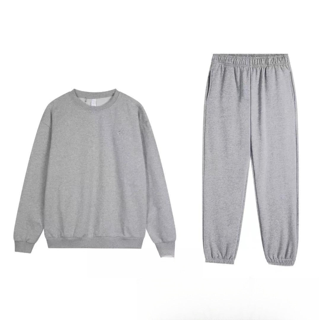 Gray sweatshirt and pants set on a white background