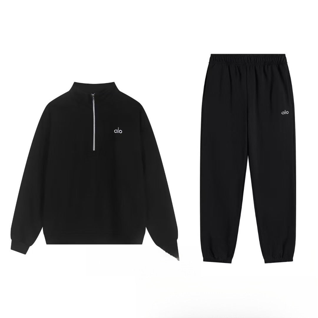 Gray hoodie and pants set on a white background