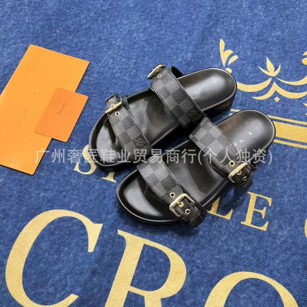 Black checkered sandals on a blue background with gold text