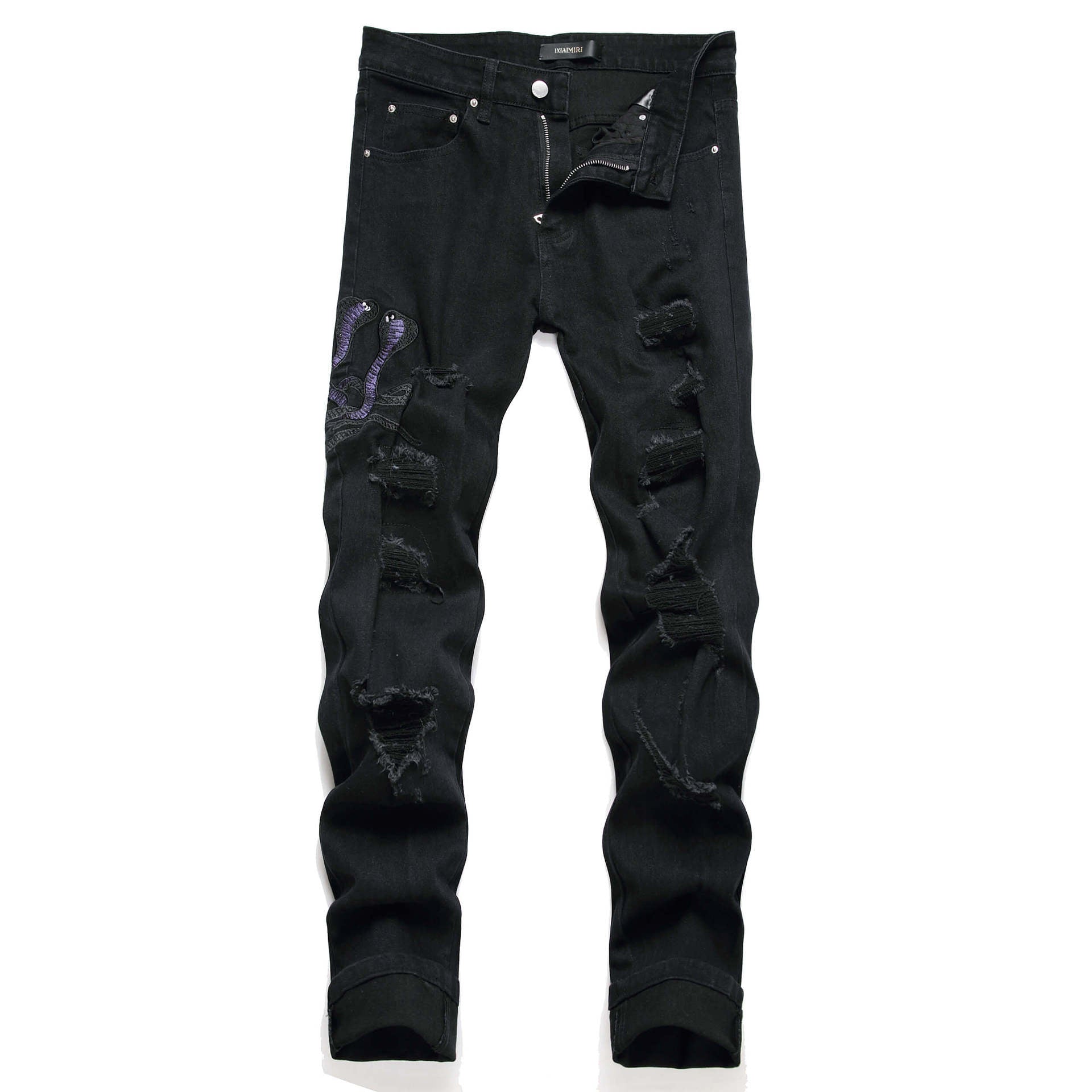 Black distressed jeans on a white background