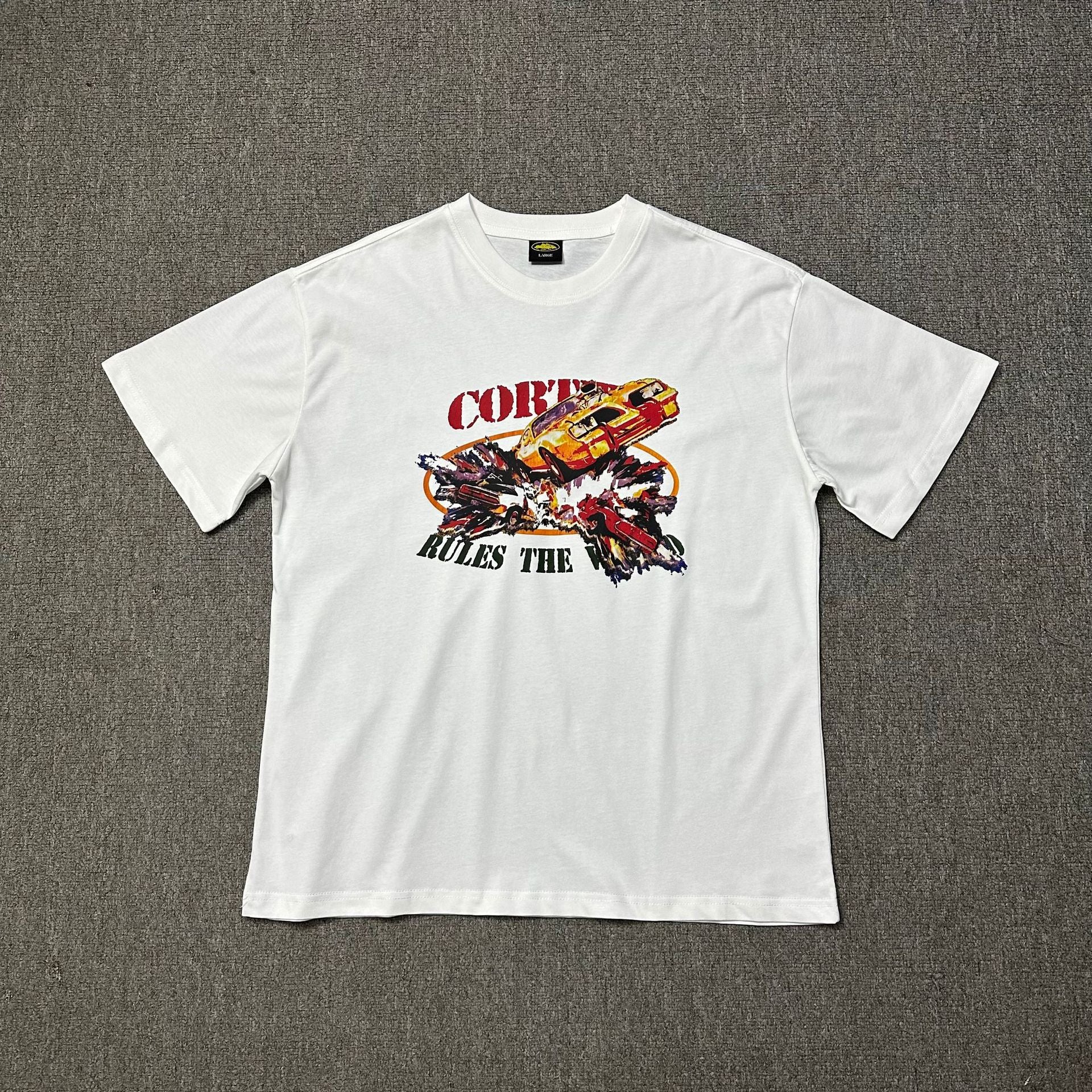 White t-shirt with a graphic design on a gray background
