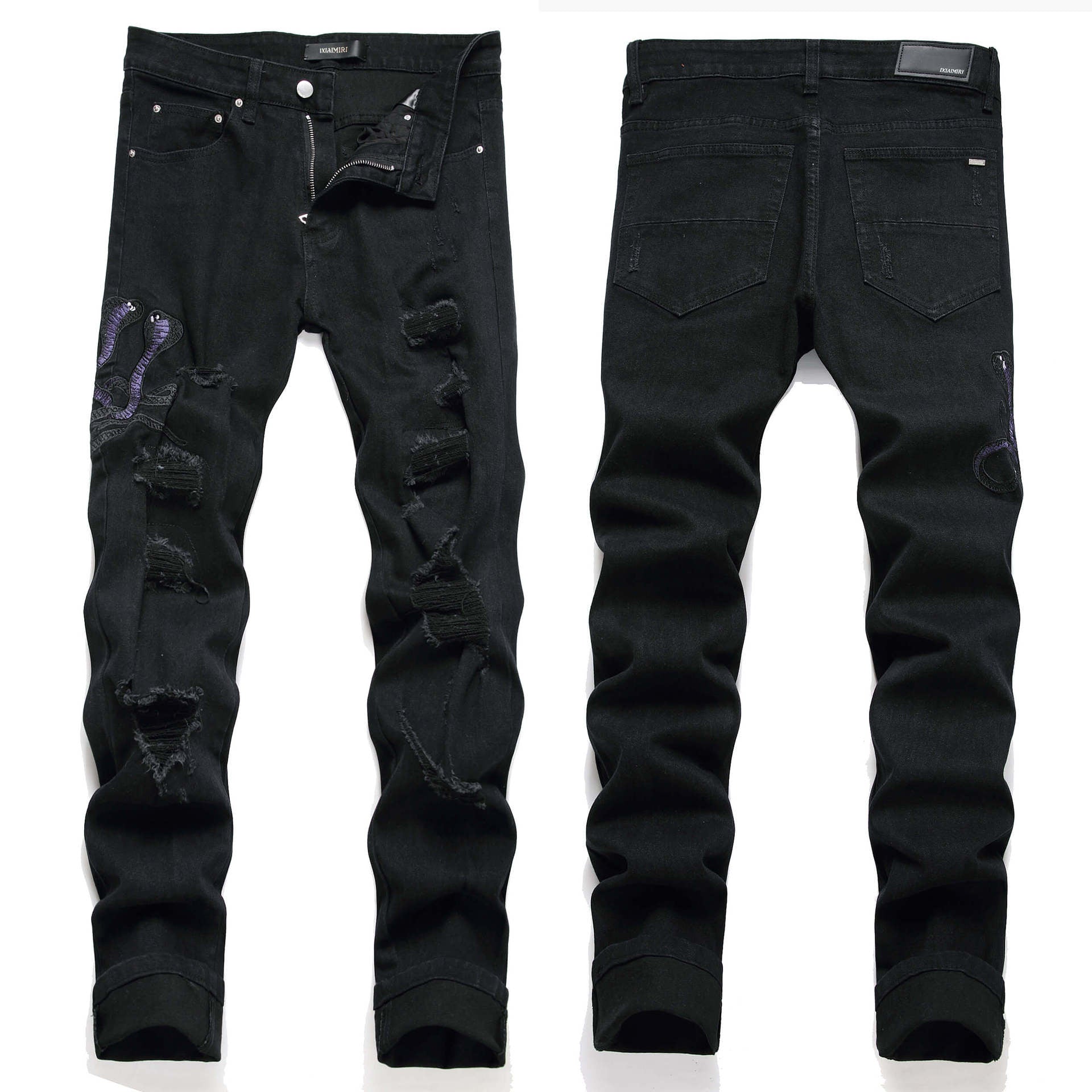 Black distressed skinny jeans shown from both front and back views, featuring ripped details and decorative patches on a white background.