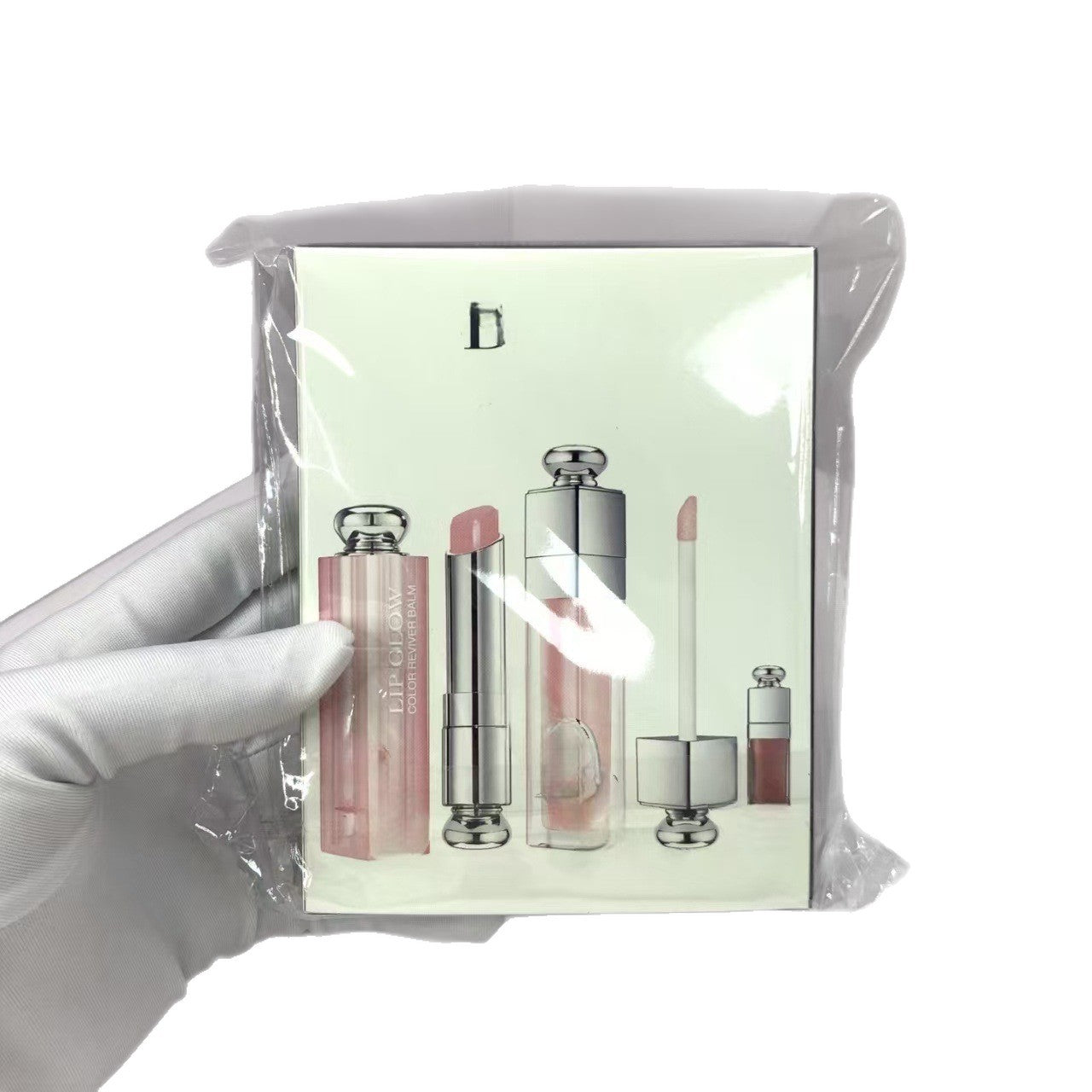 Set of lipsticks in a clear packaging with a white background