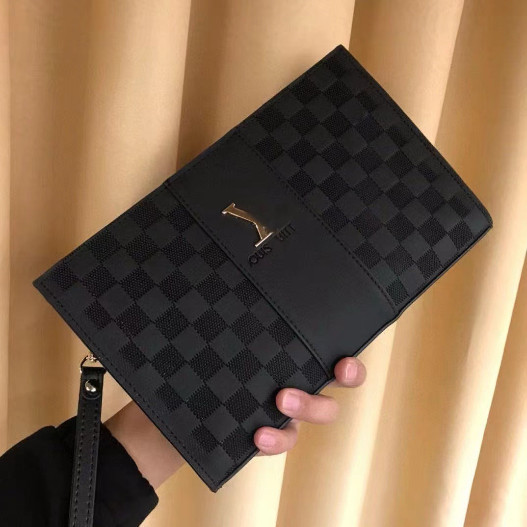 A black checkered clutch bag with a gold-tone Louis Vuitton logo, held by a hand against a beige curtain background.