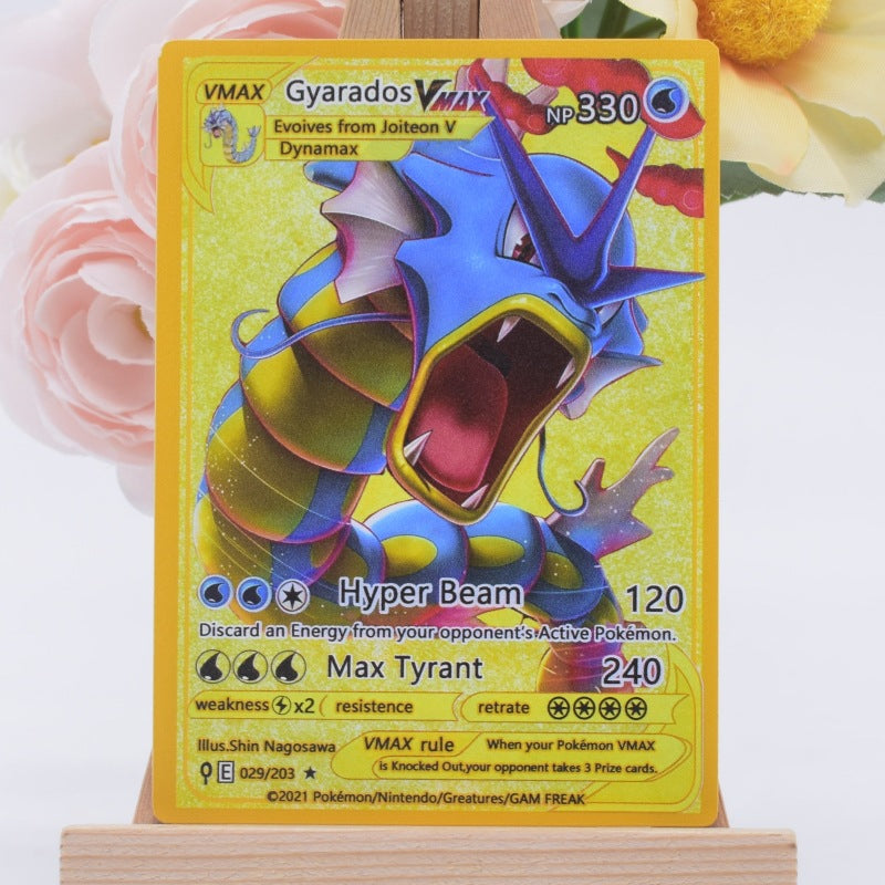 A Pokémon trading card featuring Gyarados, displayed upright on a small wooden stand against a soft floral background with pink and yellow flowers.