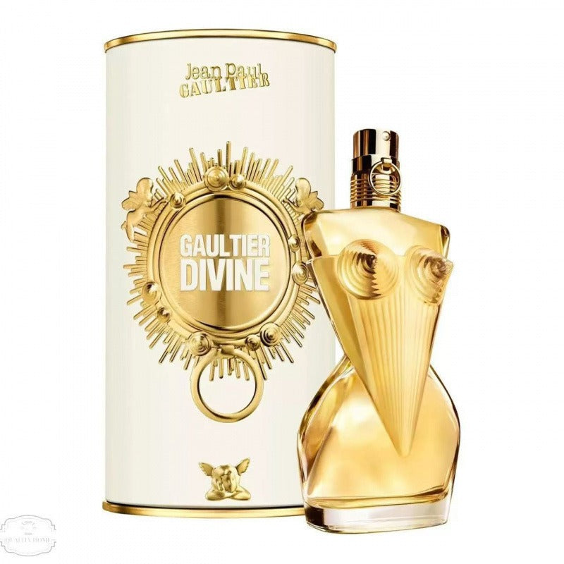 Gold perfume bottle and packaging with 'Jean Paul Gaultier Divine' branding on a white background