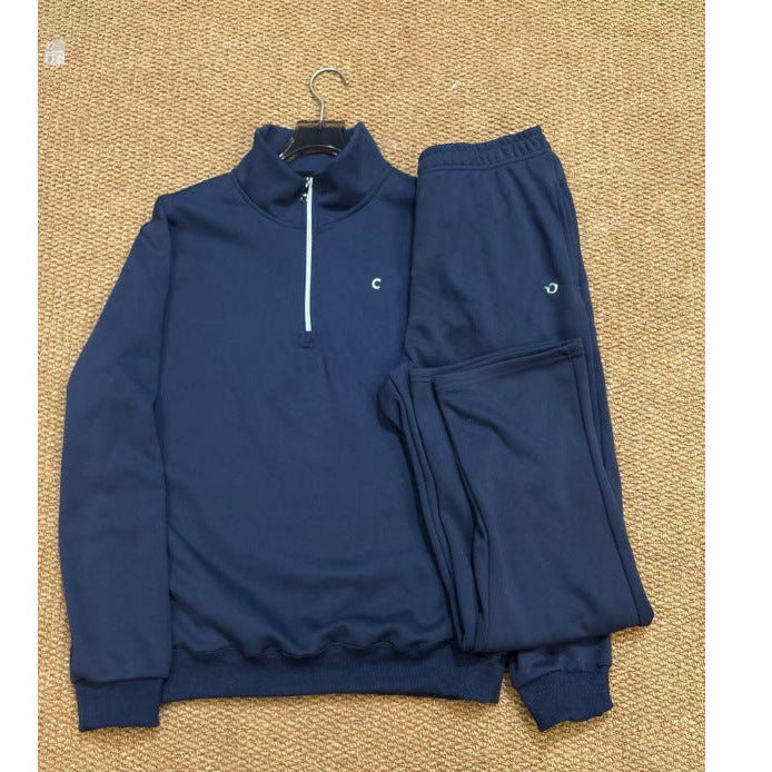 Blue tracksuit on a beige textured background
