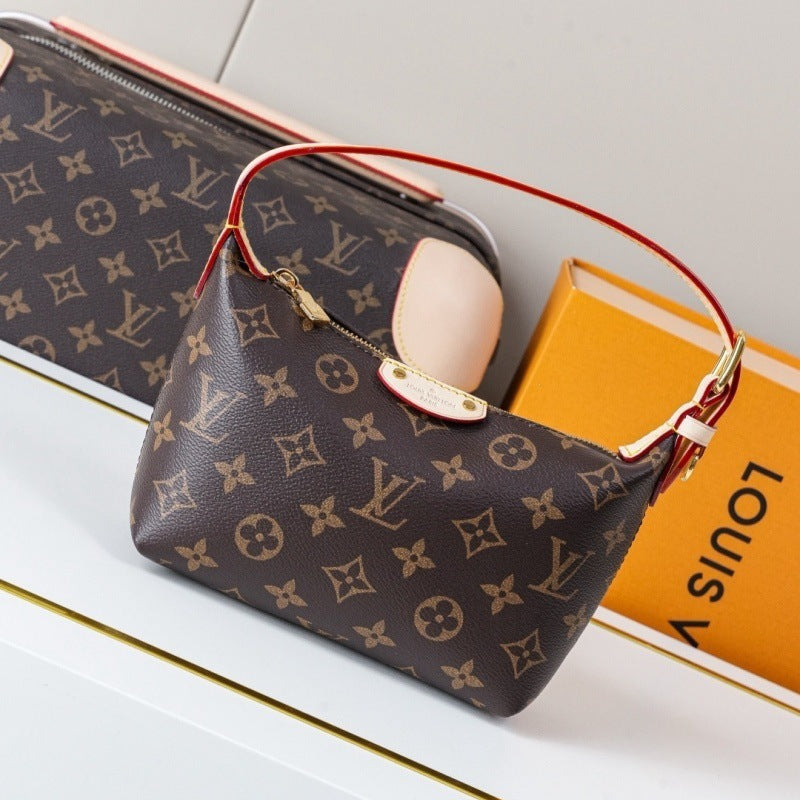 Louis Vuitton monogram canvas shoulder bag in dark brown with tan LV logos, a red leather strap, and gold-tone hardware, shown with a matching zip pouch and an orange Louis Vuitton box on a white surface.