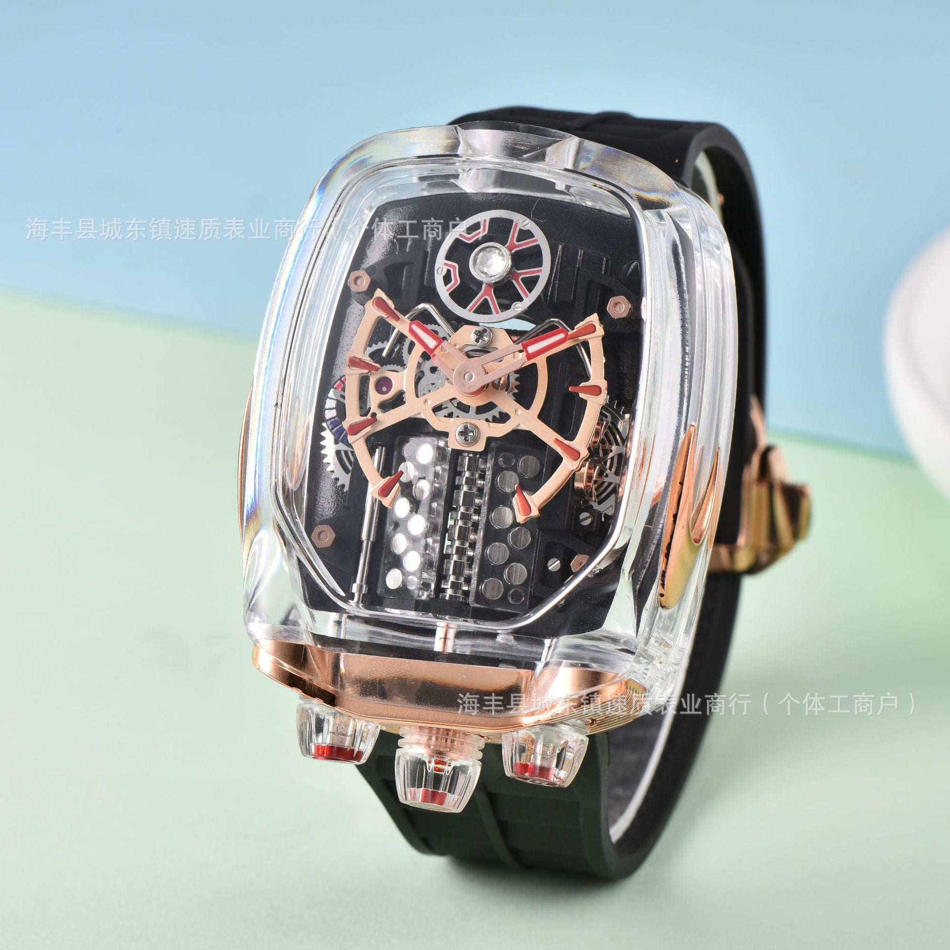 Luxury watch with transparent case and black strap on a light blue and green gradient background