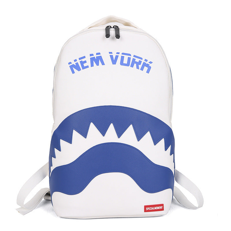 A white backpack featuring a blue shark-mouth graphic and the text 'NEM VORK' in blue on the front, with white shoulder straps and a small red 'SPECIALME' label near the bottom right.