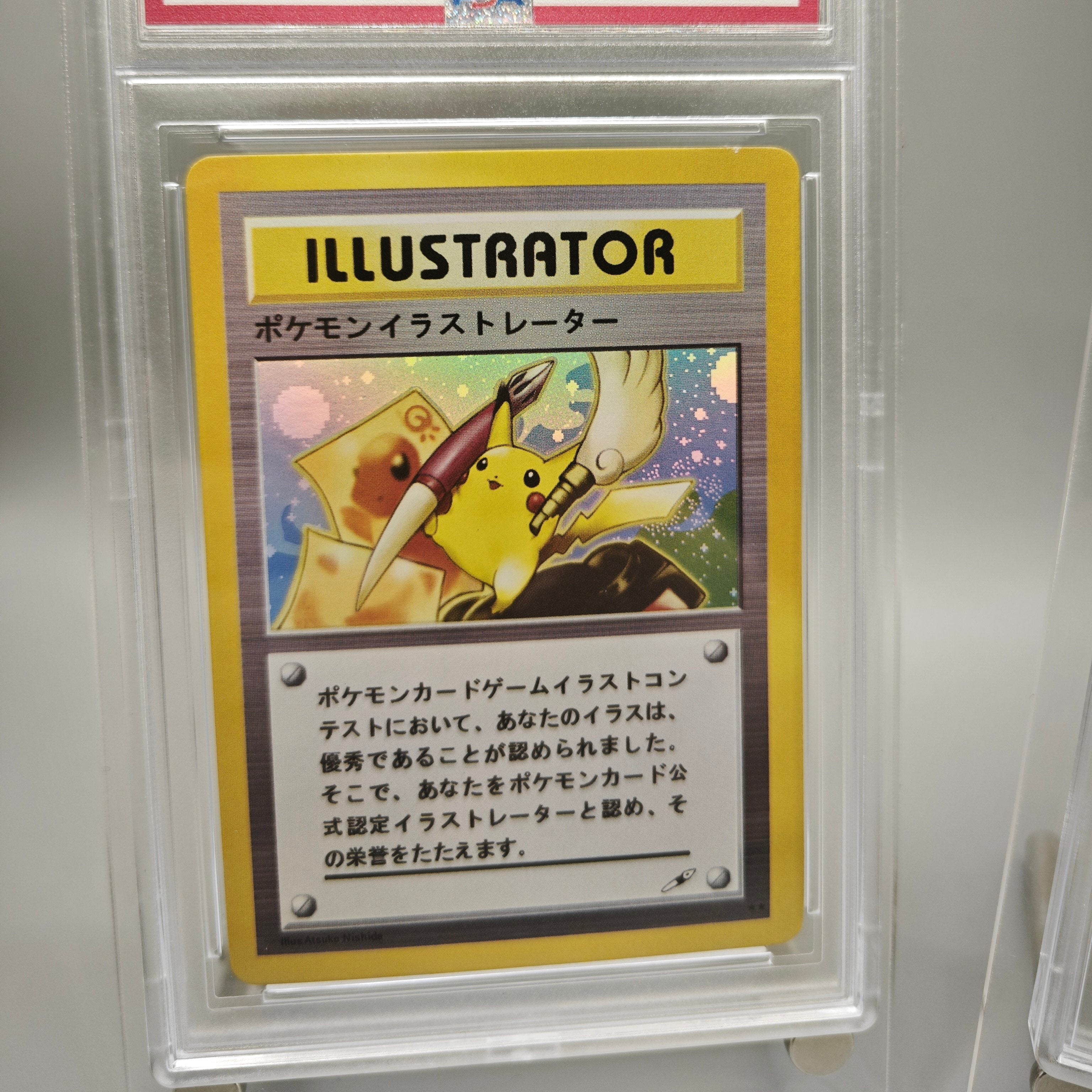 A Pokémon Illustrator card inside a clear plastic protective display case, photographed against a light gray background.