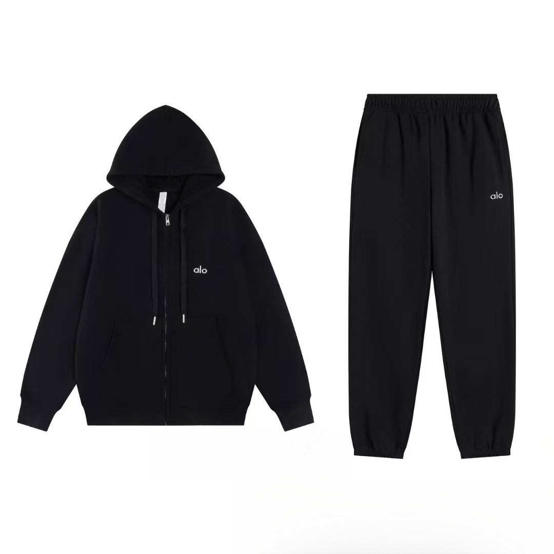 Black hoodie and pants set with a logo on a white background