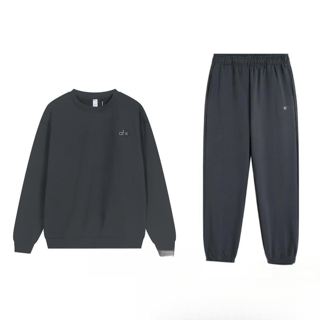 Dark gray sweatshirt and pants set on a white background