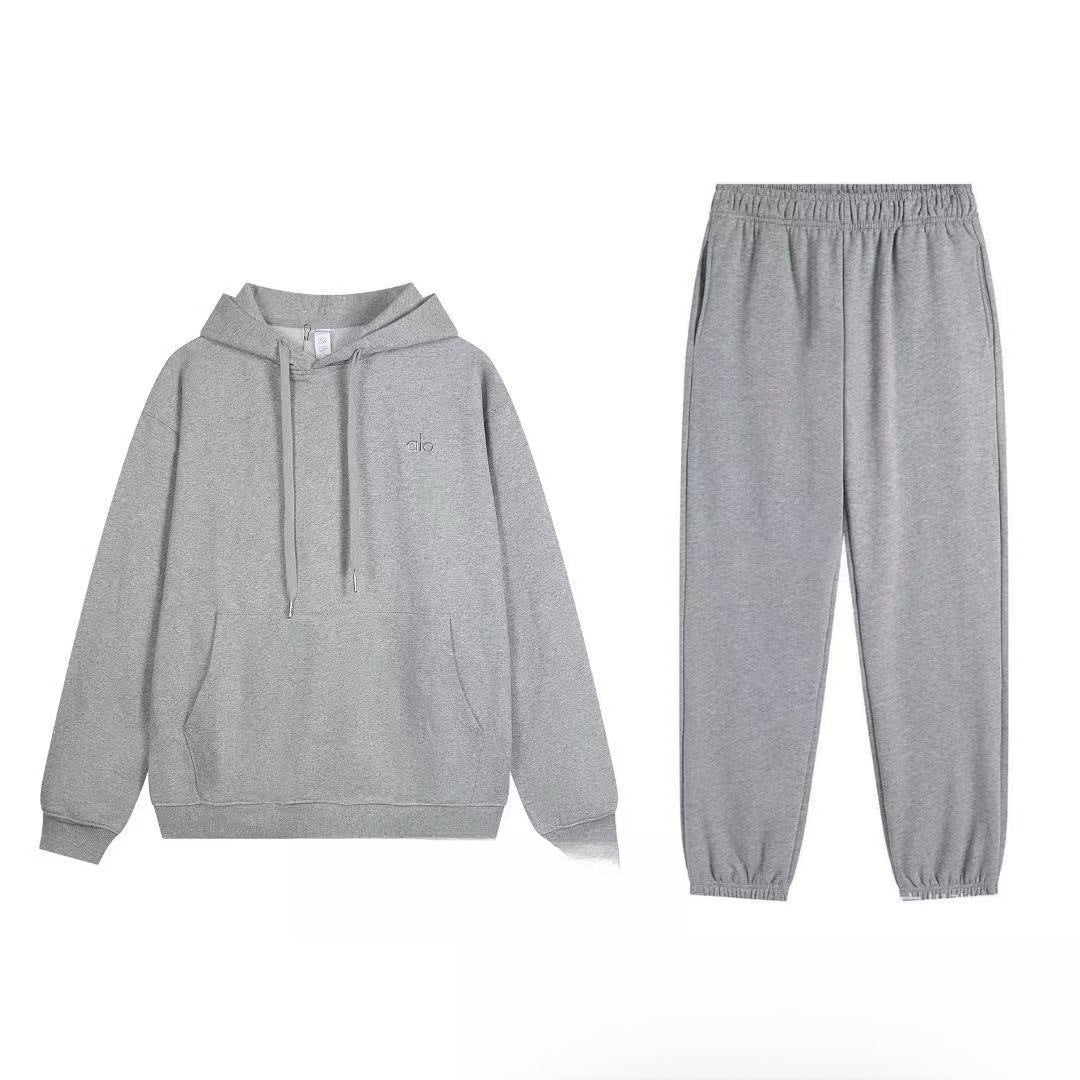 Gray hoodie and pants set on a white background