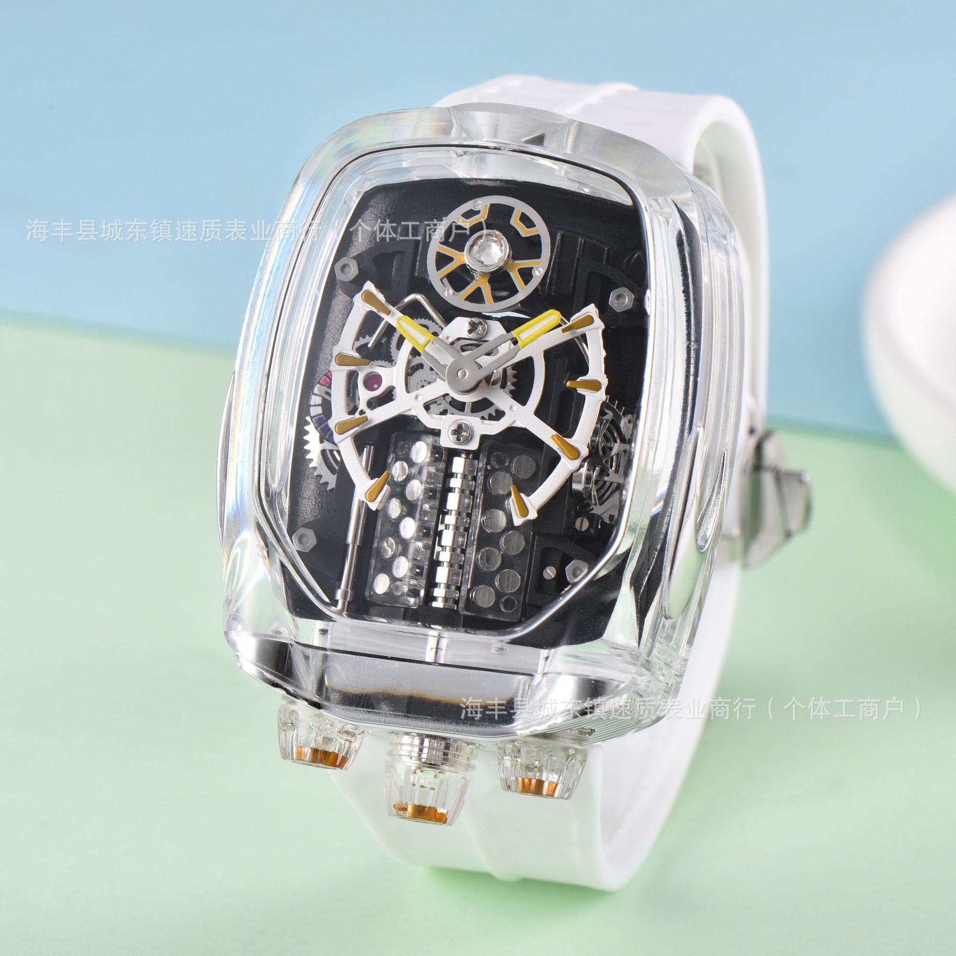Watch with transparent case and white strap on a light blue and green gradient background