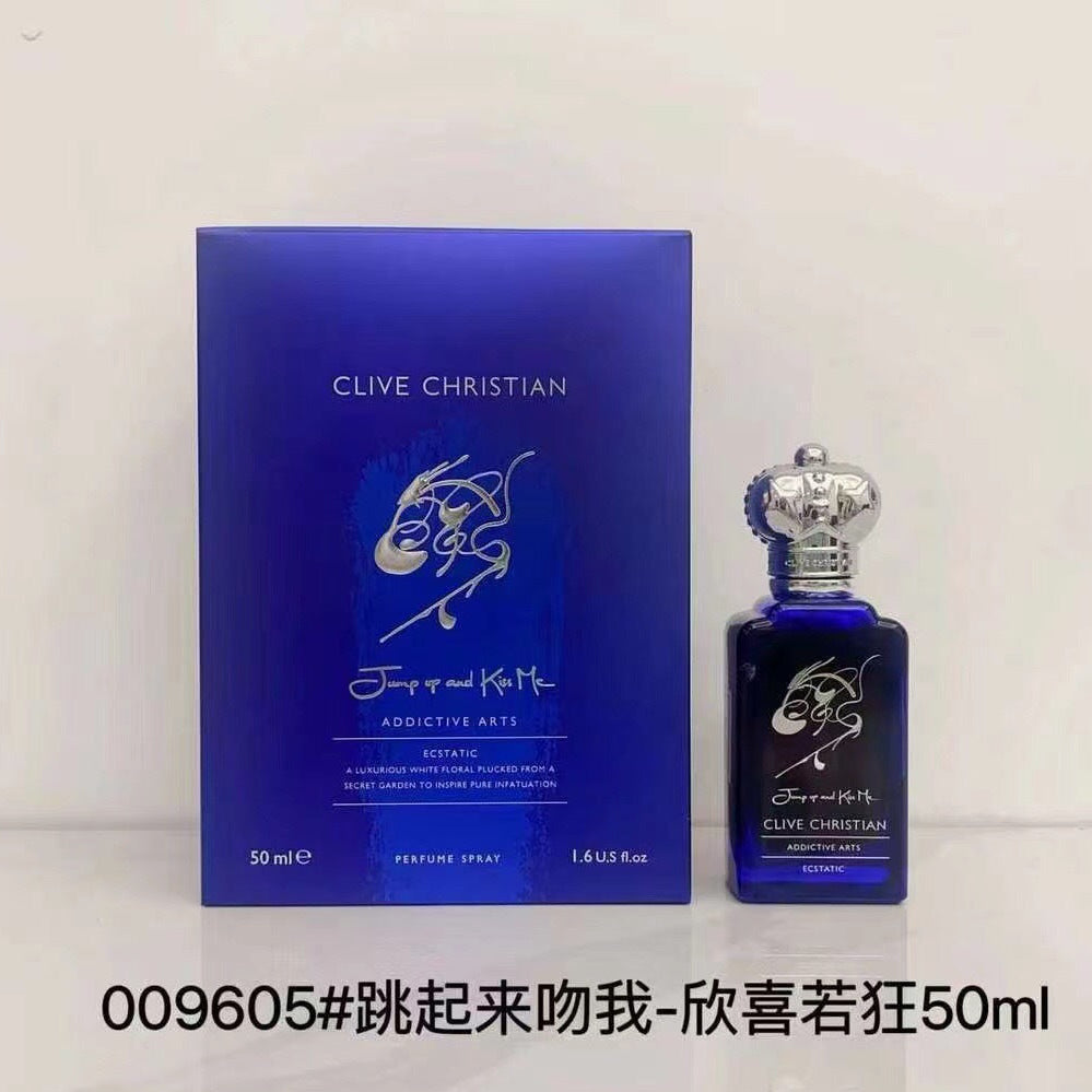 Clive Christian Addictive Arts Botanic perfume 50ml bottle and its blue packaging box, displayed on a light background with a product code text overlay at the bottom.