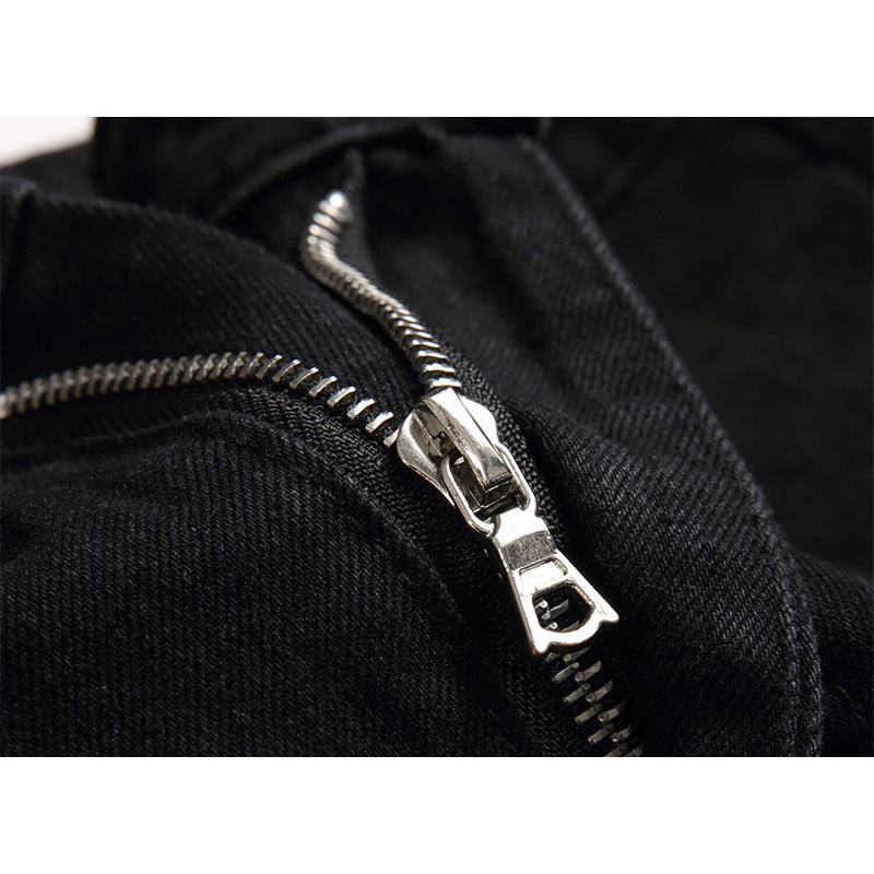 Close-up of a silver zipper on a black jacket
