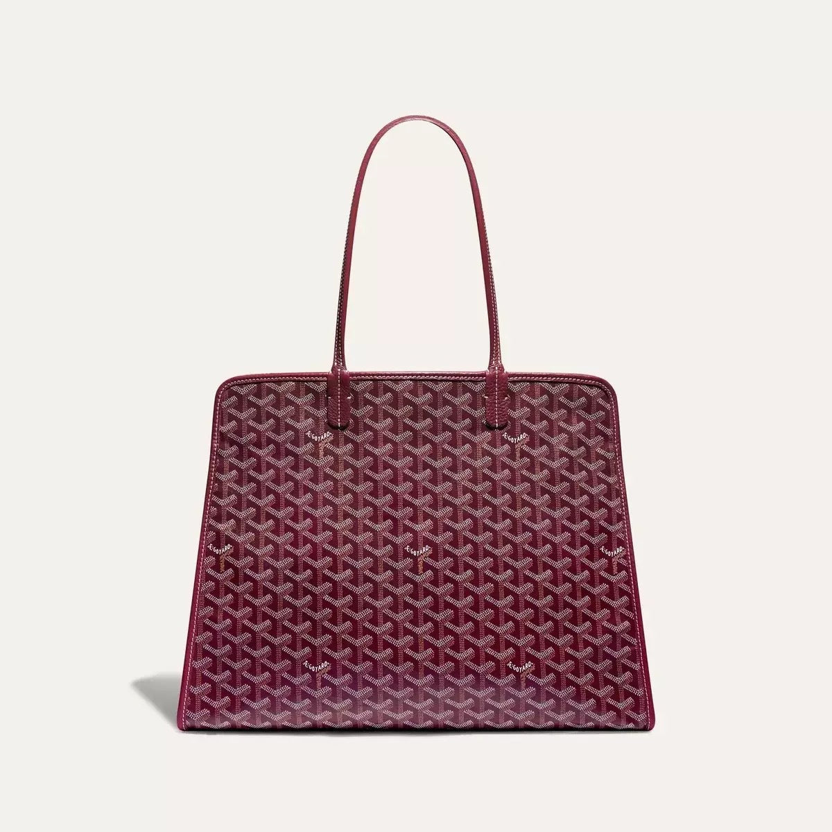 Red patterned handbag on a light gray background