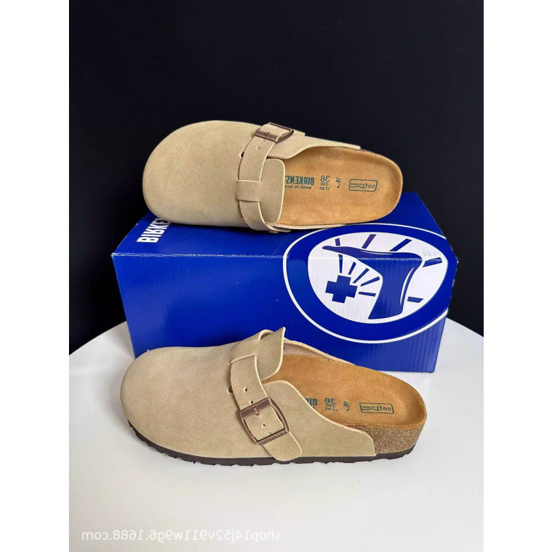 Beige clogs with a blue box featuring a logo on a white background