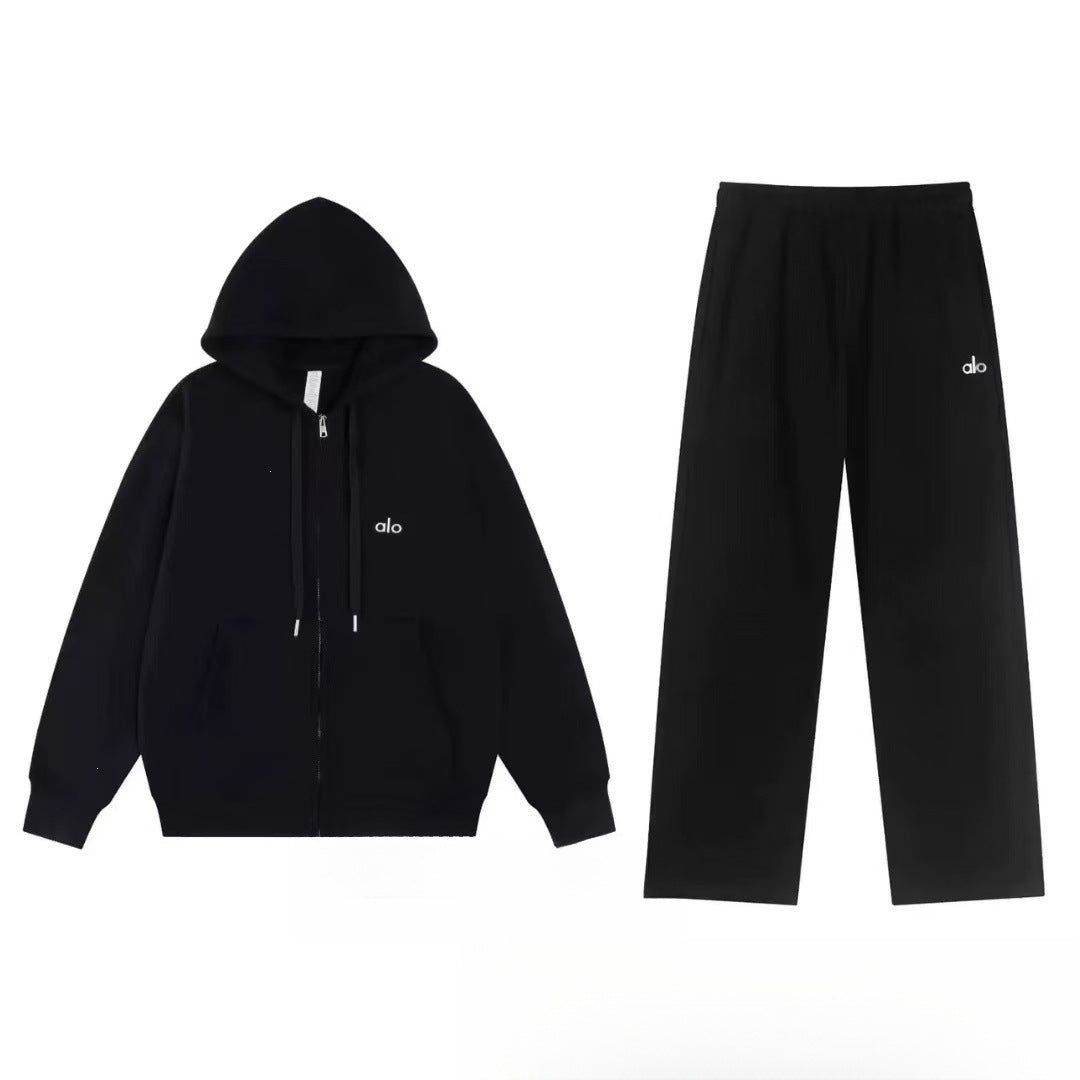 Black hoodie and pants set on a light gray background