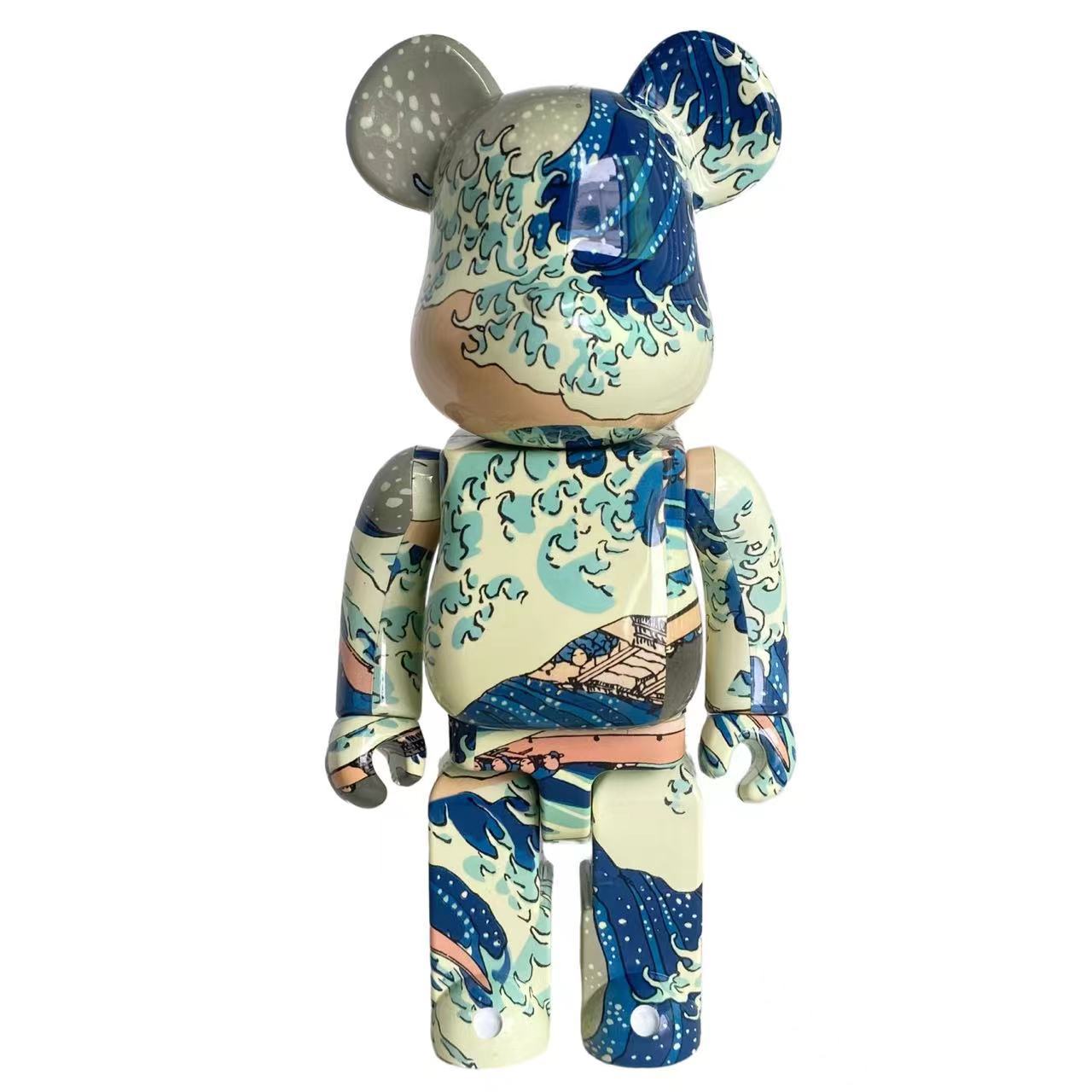 A 400% Bearbrick toy figure featuring a detailed print of 'The Great Wave off Kanagawa' by Katsushika Hokusai, shown against a plain white background.