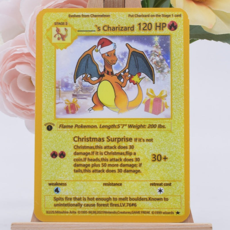 A Christmas-themed Charizard trading card displayed on a small stand, with soft pink flowers in the background.