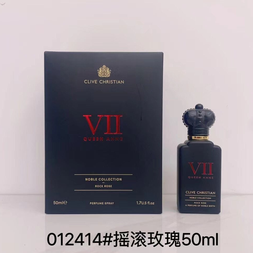 Clive Christian VII Queen Anne Rock Rose perfume spray 50ml bottle next to its dark navy blue box packaging, with a black text overlay at the bottom.