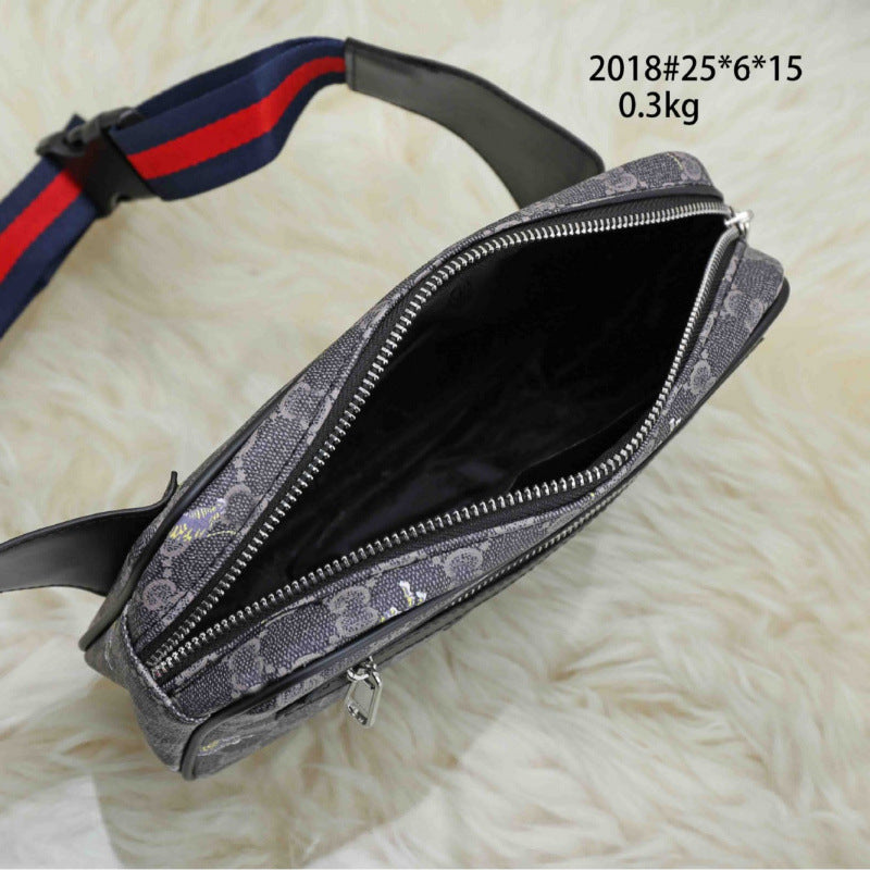 A gray patterned crossbody bag with a navy and red striped strap, shown open on a white faux fur background. Text in the top right reads '2018#25*6*15 0.