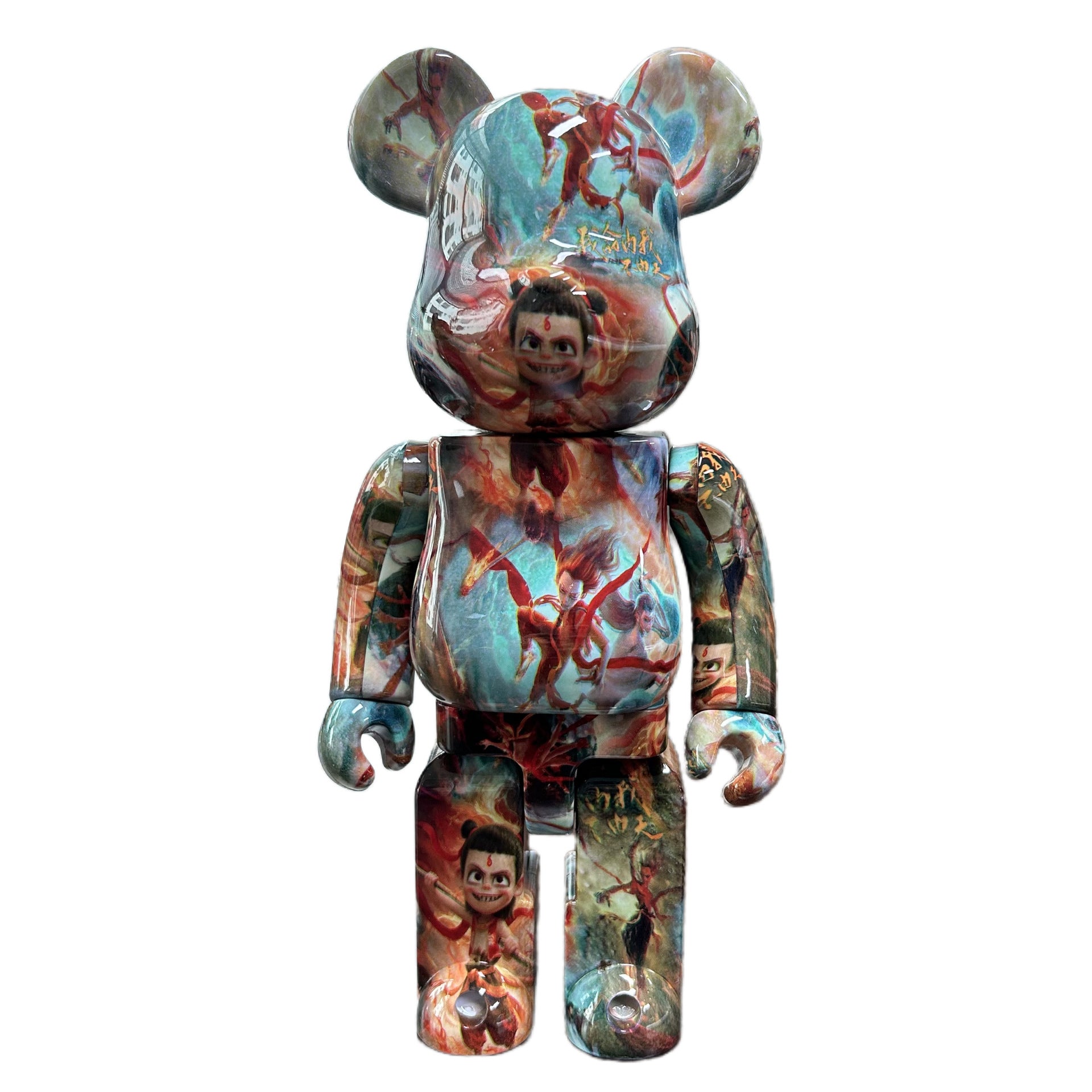 A collectible bear-shaped figure with a glossy, multicolored printed design featuring characters and scenes from Disney's The Lion King, set against a plain white background.