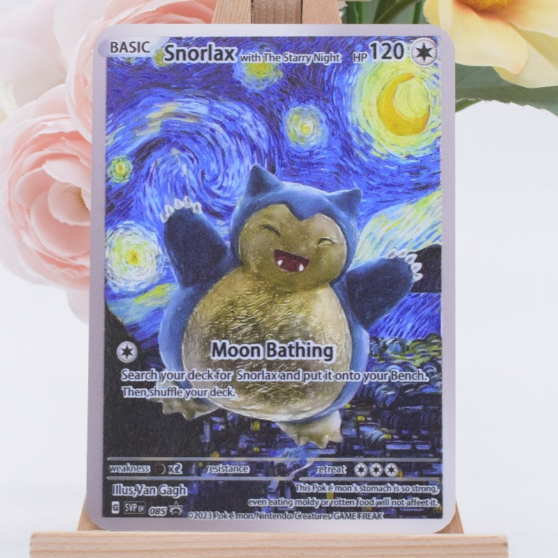 A Snorlax trading card featuring artwork from Van Gogh's Starry Night with the title 'Moon Bathing', displayed on a wooden stand with soft pink and yellow flowers in the background.
