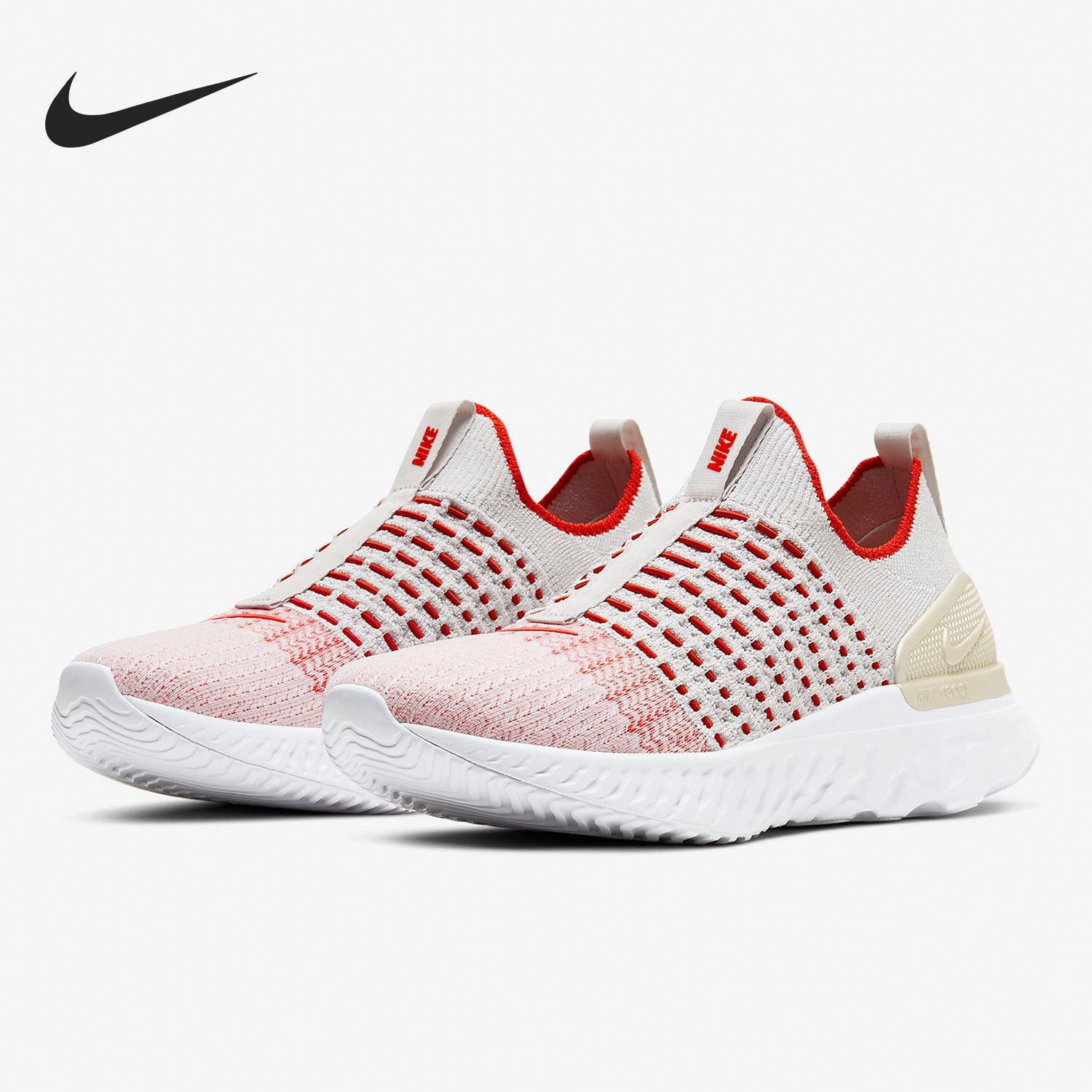 Pair of Nike running shoes with pink and white design on a white background