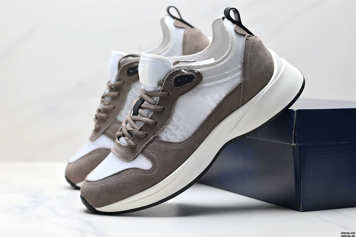Pair of gray and white sneakers on a light background