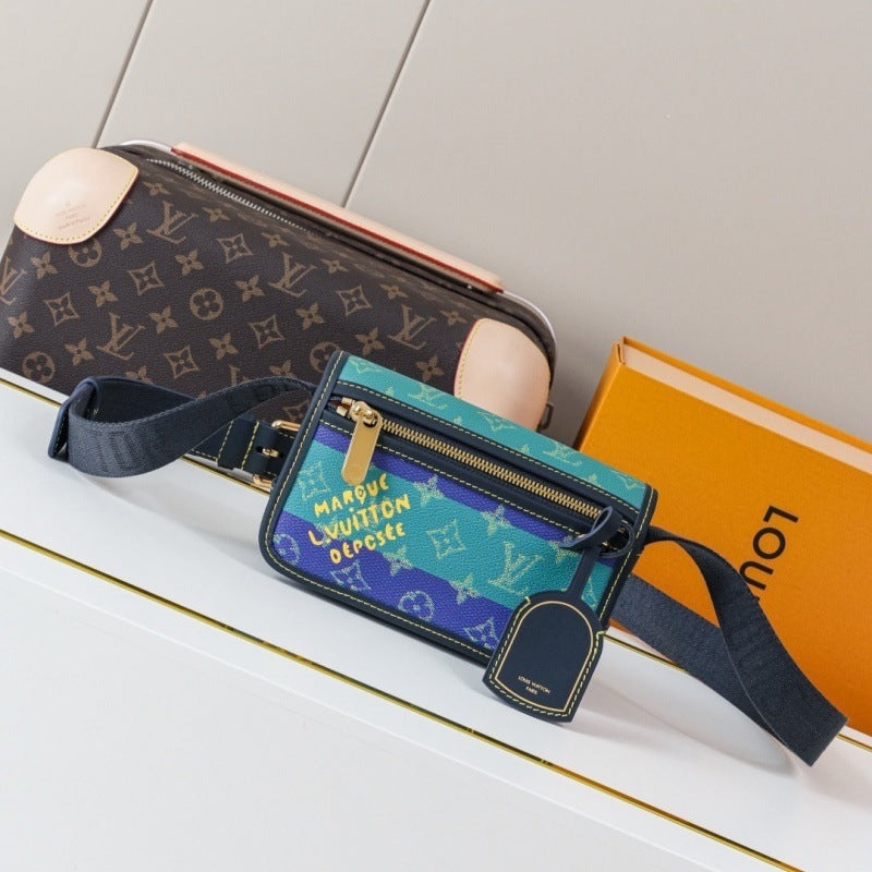 A Louis Vuitton crossbody bag in the center, featuring a blue and green monogram pattern with yellow text, alongside a brown monogram shoulder bag and an orange Louis Vuitton box on a white surface.