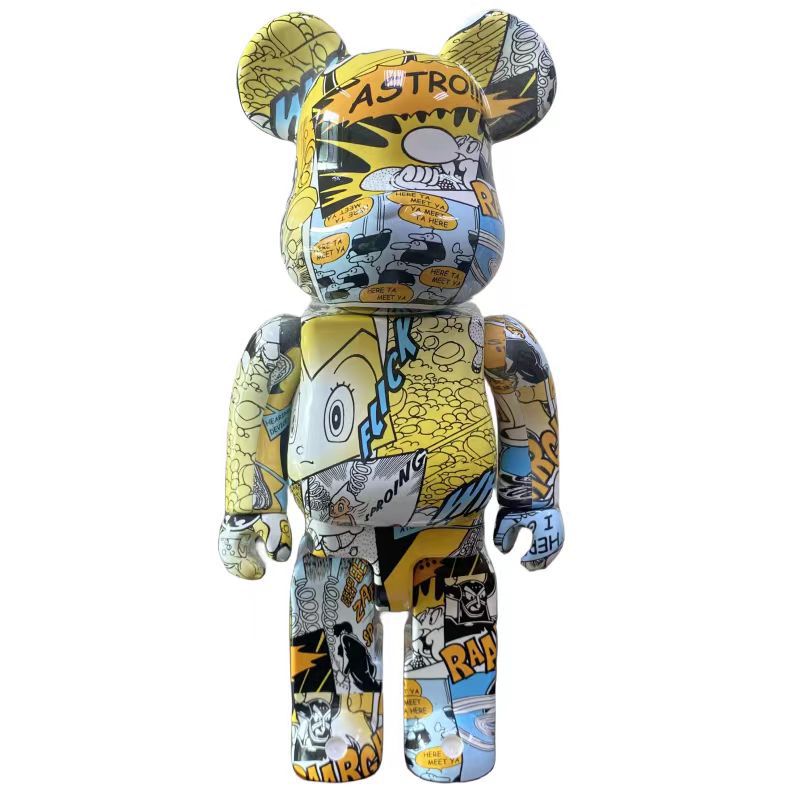 Multicolored bear-like plush toy with graphic design on a white background