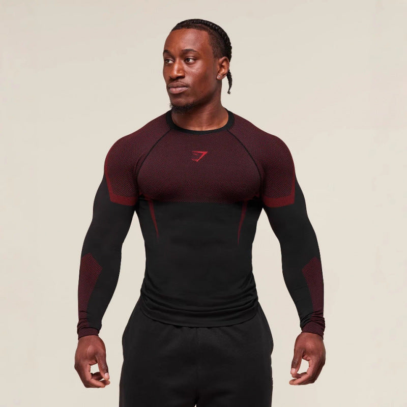 Man wearing a black and red athletic outfit on a beige background