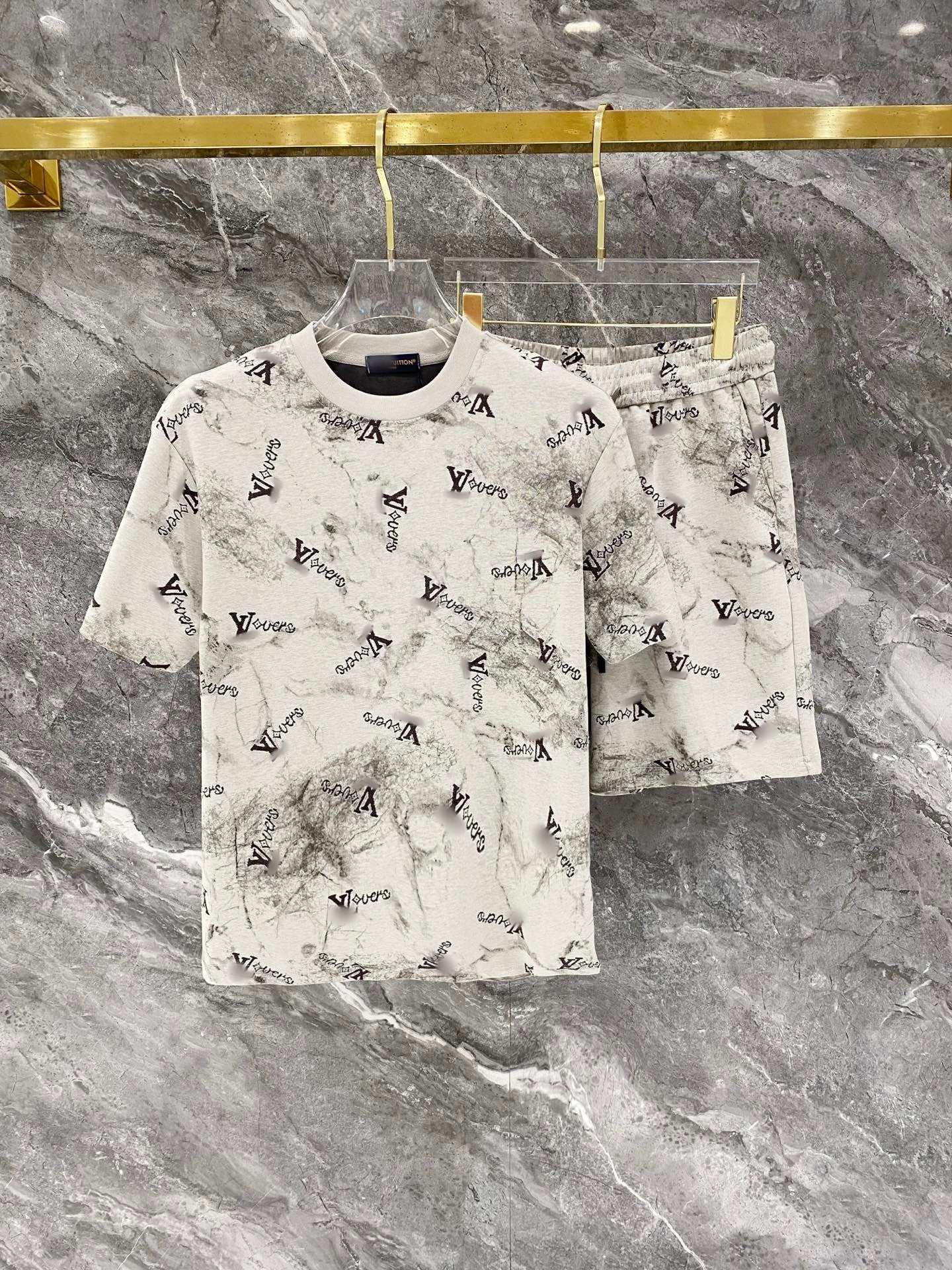 Louis Vuitton-themed t-shirt and shorts set on a marble surface