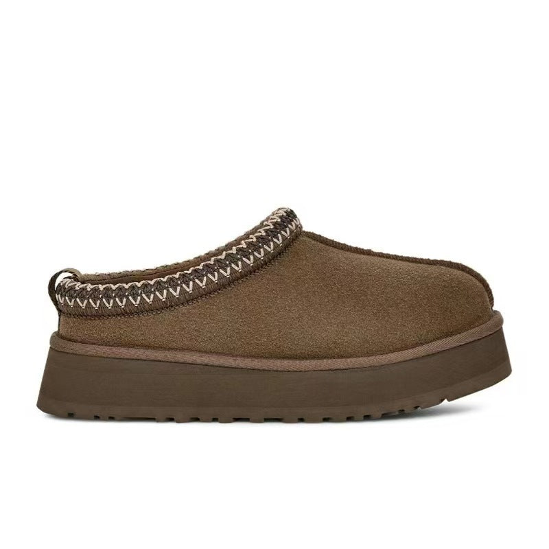 Brown slipper with a textured strap on a white background