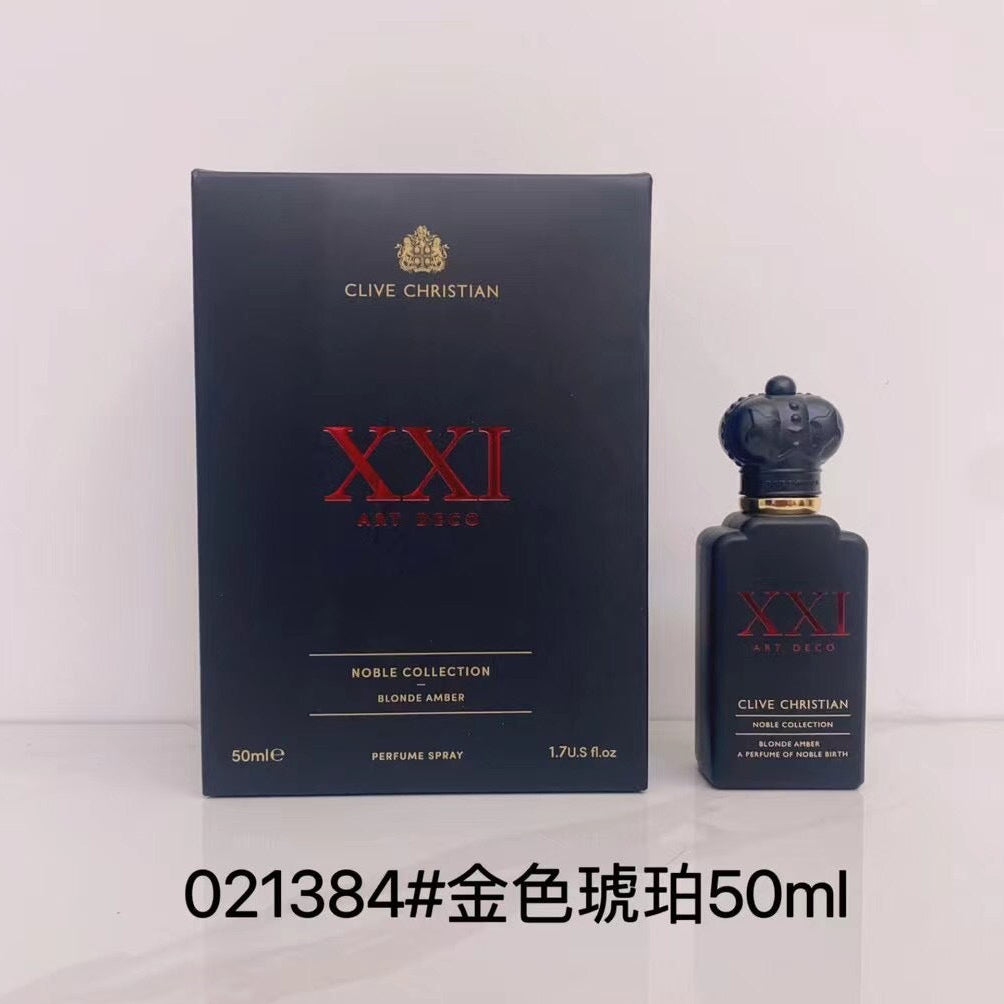 Clive Christian XXI Art Deco perfume spray 50ml bottle next to its dark navy blue box, with Chinese text overlay indicating gold-colored pearl fragrance.