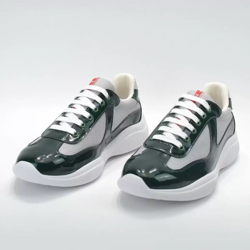 Pair of black and white sneakers on a light gray background