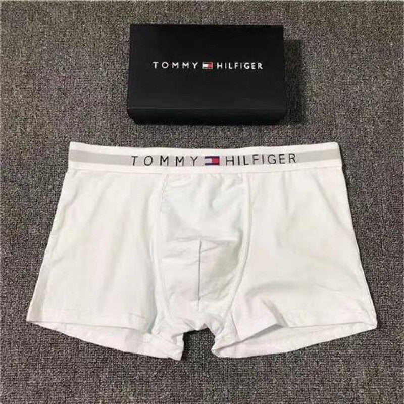 Tommy Hilfiger white boxer briefs with packaging on a gray surface
