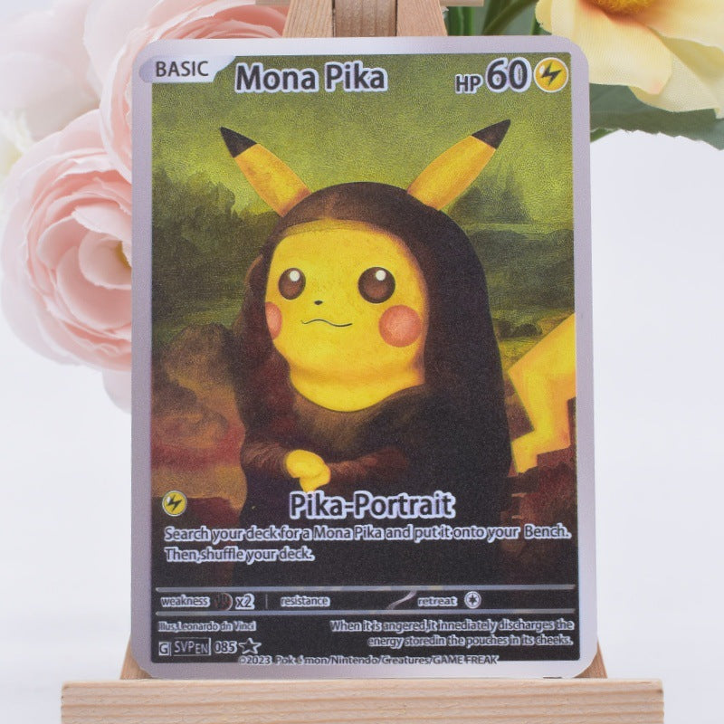 A Pokémon trading card featuring Mona Pika in a black portrait costume, displayed upright on a small wooden stand with blurred pink flowers in the background.